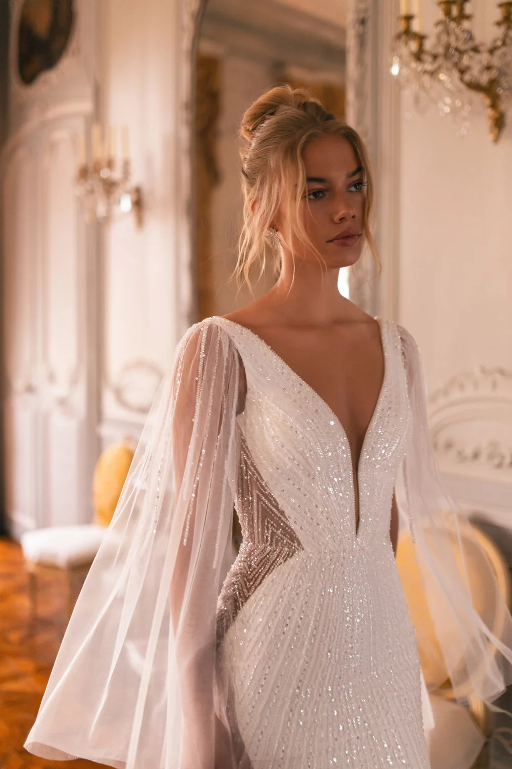 Embellished mermaid wedding dress with flowing cape and plunging neckline — Katy Corso Glen | Endless UAE