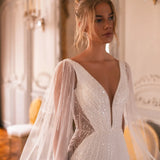 Embellished mermaid wedding dress with flowing cape and plunging neckline — Katy Corso Glen | Endless UAE