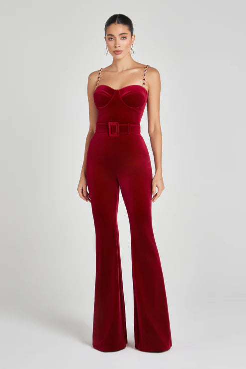 Elegant red velvet jumpsuit with sweetheart neckline, chain straps and flared legs — Nadine Merabi | Endless UAE