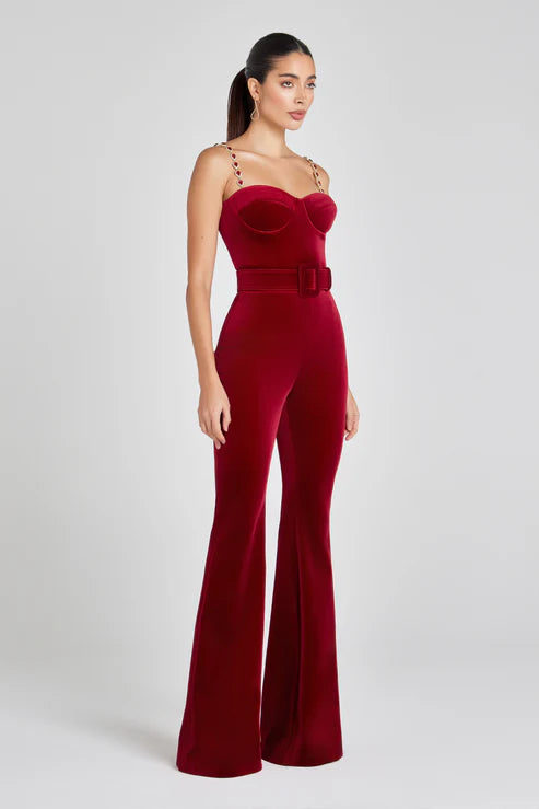Elegant red velvet jumpsuit with sweetheart neckline, embellished straps, and belted waist — Nadine Merabi | Endless UAE