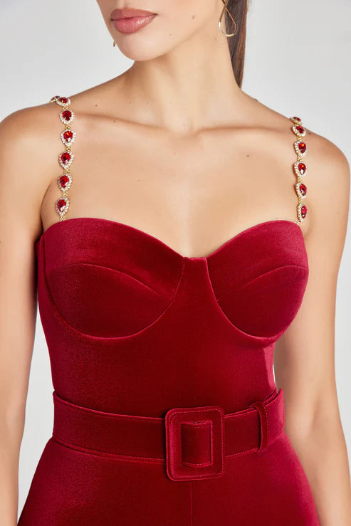 Red velvet jumpsuit with jeweled straps and belted waist detail — Nadine Merabi | Endless UAE