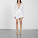 White wrap mini dress with long sleeves and gold strappy sandals — Gauge81 | Endless UAE
