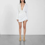 White wrap mini dress with long sleeves and gold strappy sandals — Gauge81 | Endless UAE