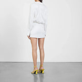White wrap mini dress with long sleeves and gold strappy sandals — Gauge81 | Endless UAE