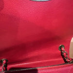 Red leather curved messenger bag with interlocking CC logo detail — Chanel | Endless UAE