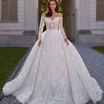 Elegant off-shoulder ball gown wedding dress with intricate lace detailing and long sleeves — Sima Couture | Endless UAE