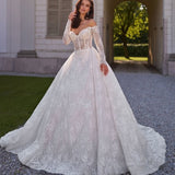 Elegant off-shoulder lace ball gown wedding dress with long sleeves and cathedral train in ivory white — Sima Couture | Endless UAE
