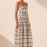 Woman wearing Niko Gathered Bubble Midi Dress in cream check pattern with strappy white sandals — Shona Joy | Endless UAE