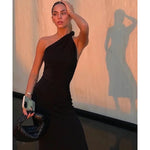Black one-shoulder velvet midi dress with red quilted bag and gold heeled sandals — Misha | Endless UAE