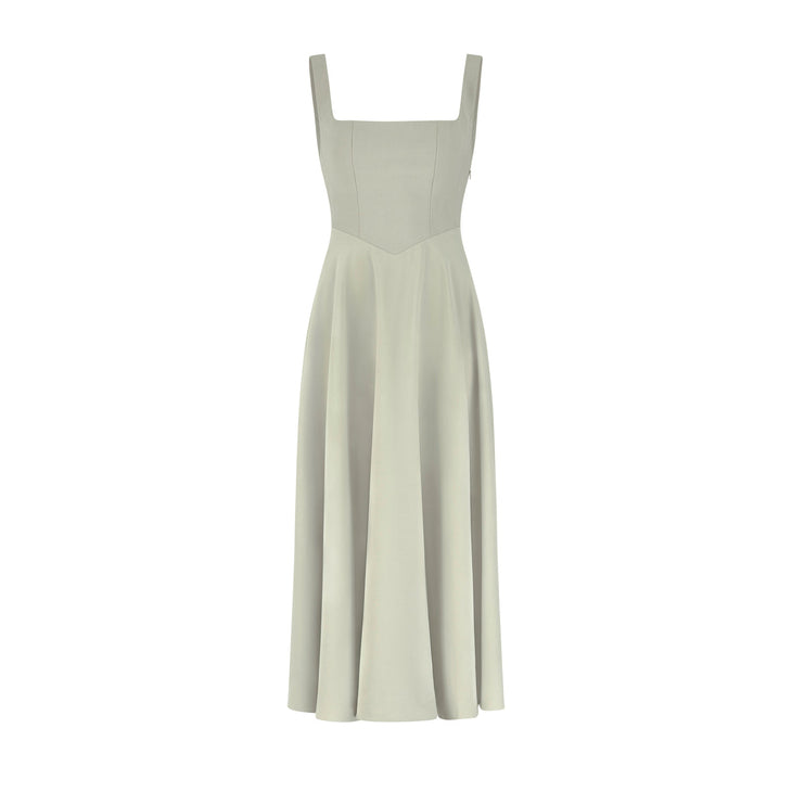 Woman wearing cream square neck midi dress with flowing skirt and white heels — Odd Muse | Endless UAE