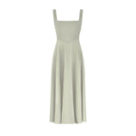 Woman wearing sage green square neck midi dress with pleated skirt and white slide sandals — Odd Muse | Endless UAE