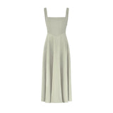 Woman wearing sage green square neck midi dress with full skirt and pockets — Odd Muse | Endless UAE