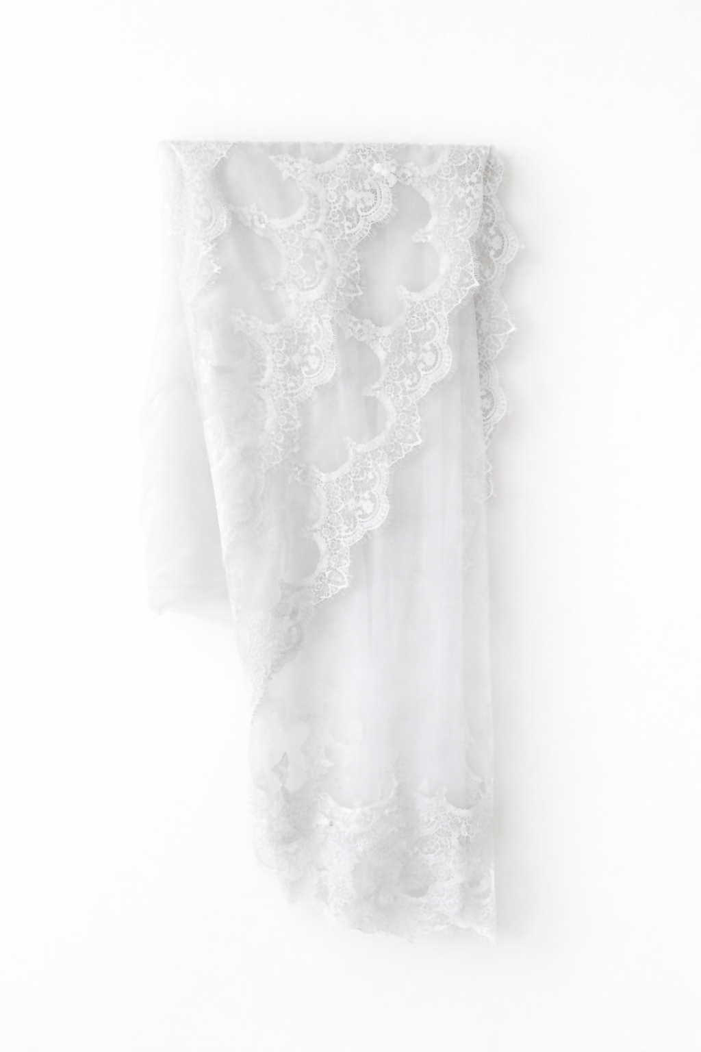 Elegant white lace wedding dress with long sleeves and flowing tulle train — Tatiana Kaplun | Endless UAE