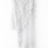 Elegant white lace wedding dress with long sleeves and flowing tulle train — Tatiana Kaplun | Endless UAE