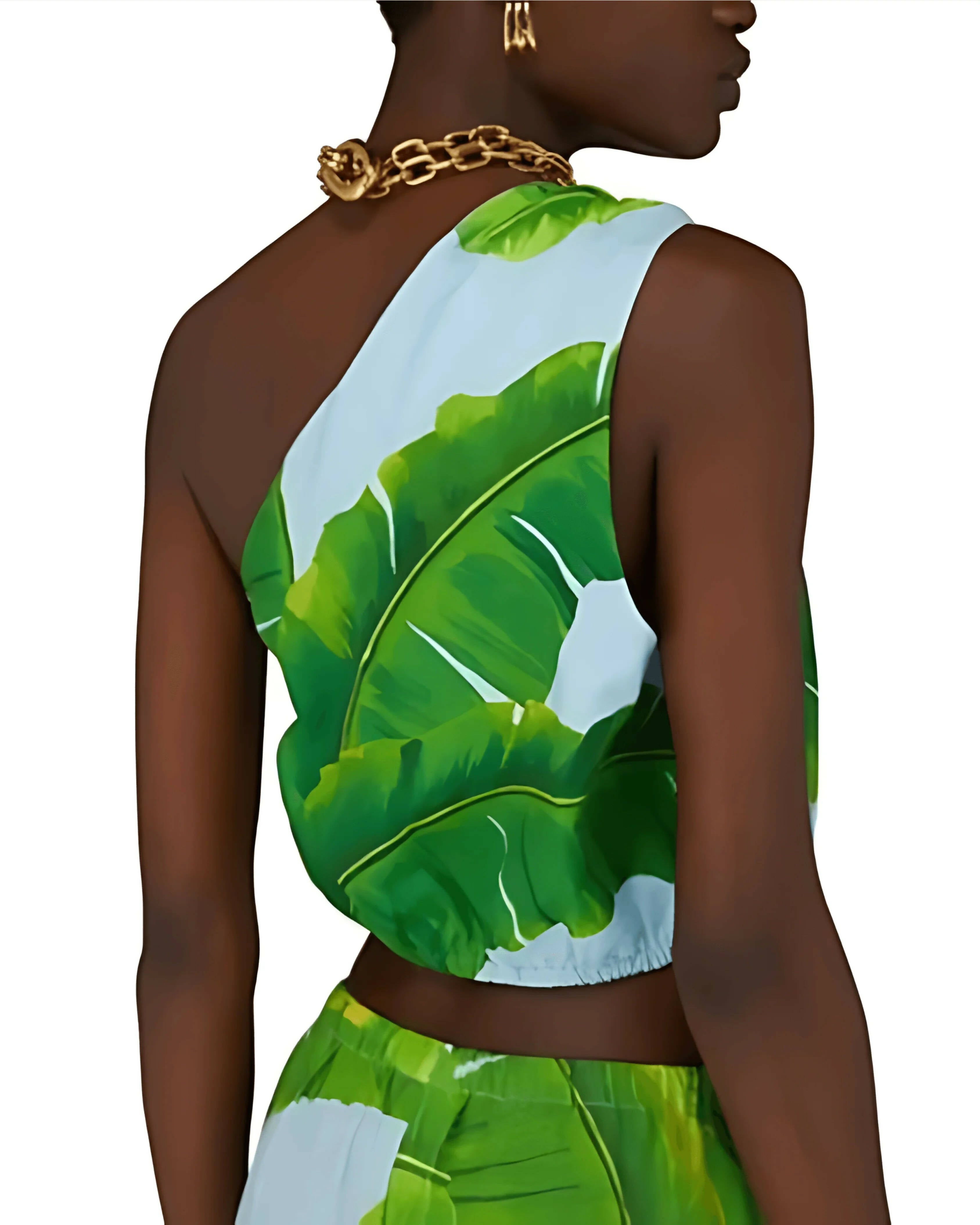 Model wearing tropical banana leaf print one-shoulder crop top with light blue background and gold chain necklace — Farm Rio | Endless UAE