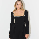Black mini dress with pearl-trimmed square neckline and long sleeves — Odd Muse | Endless UAE