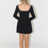 Black mini dress with pearl-trimmed square neckline and long sleeves — Odd Muse | Endless UAE