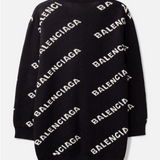 Black knit cardigan with diagonal white Balenciaga logo pattern across the body — Balenciaga | Endless UAE