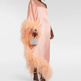 Peach silk one-shoulder maxi dress with feather trim and silver clutch — Taller Marmo | Endless UAE