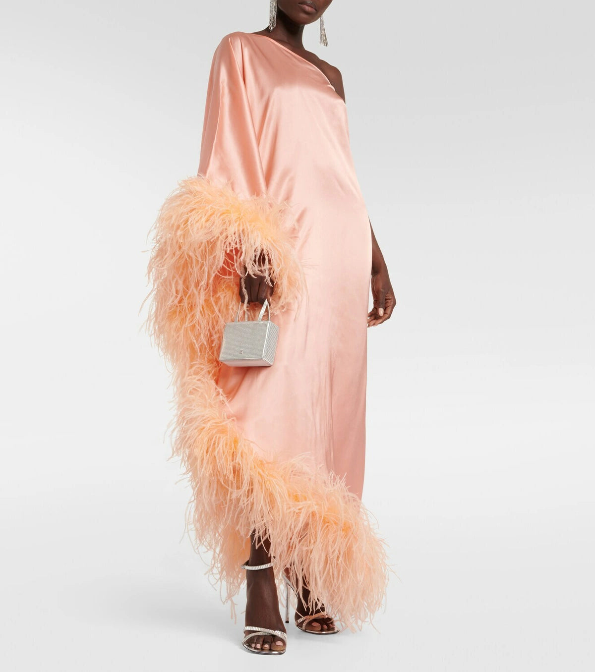 Peach silk one-shoulder maxi dress with feather trim and silver clutch — Taller Marmo | Endless UAE