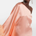 Peach silk one-shoulder maxi dress with feather trim and silver clutch — Taller Marmo | Endless UAE