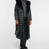 Black quilted down coat with faux fur hood collar worn with gray turtleneck sweater and black trousers — Max Mara | Endless UAE