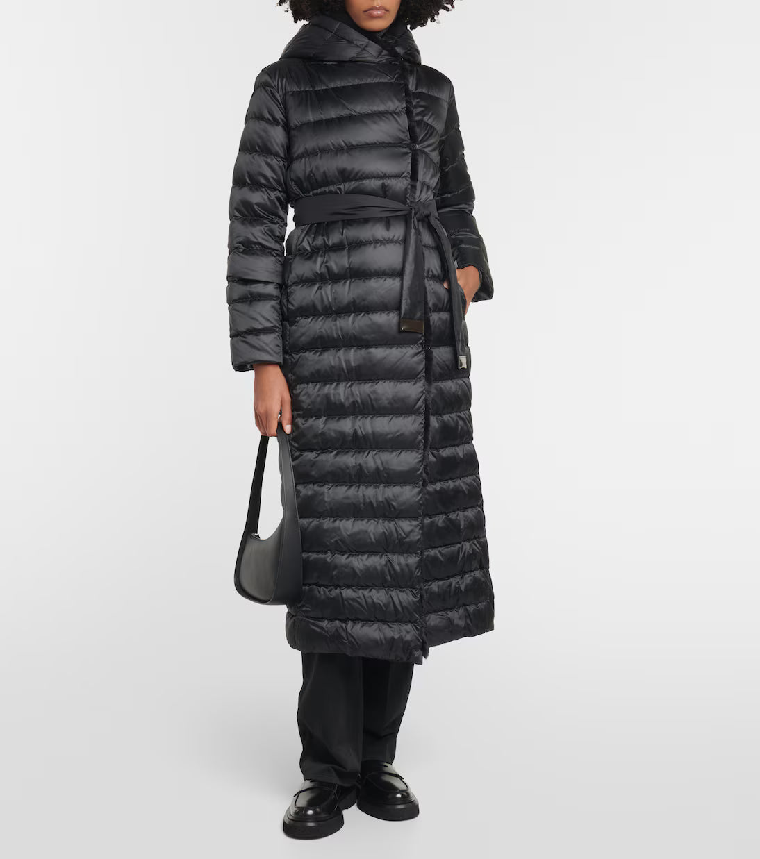 Black quilted down coat with belt and hood worn with matching accessories — Max Mara | Endless UAE