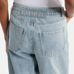 Light blue straight-leg jeans with embroidered logo detail at back waistband and classic five-pocket styling — Rotate | Endless UAE
