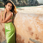Lime green Scoop Dress with open back detail worn by model against textured wall — By Keara | Endless UAE