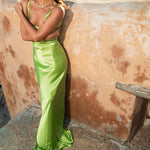 Lime green Scoop Dress with open back detail worn by model against textured wall — By Keara | Endless UAE