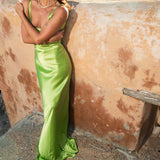 Lime green Scoop Dress with open back detail worn by model against textured wall — By Keara | Endless UAE