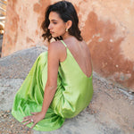 Lime green Scoop Dress with open back detail worn by model against textured wall — By Keara | Endless UAE