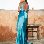 Woman wearing teal sleeveless maxi dress by water — By Keara | Endless UAE