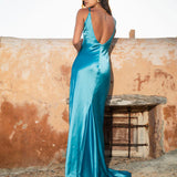 Woman wearing teal sleeveless maxi dress by water — By Keara | Endless UAE