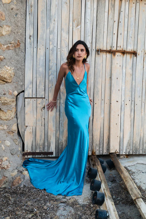 Elegant turquoise backless maxi dress with draped train and plunging neckline — By Keara | Endless UAE