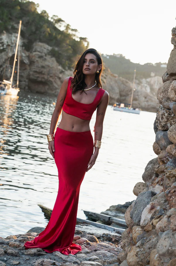 Sculpted red bralette crop top with matching maxi skirt set worn by model at waterfront cove — By Keara | Endless UAE