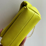 Bright yellow Twister Nano leather crossbody bag with knotted top and gold chain strap — JW Anderson | Endless UAE