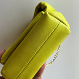 Bright yellow Twister Nano leather crossbody bag with knotted top and gold chain strap — JW Anderson | Endless UAE