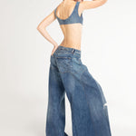 Wide-leg balloon ripped jeans with distressed knee detail in medium blue wash — Mrs. Keepa | Endless UAE