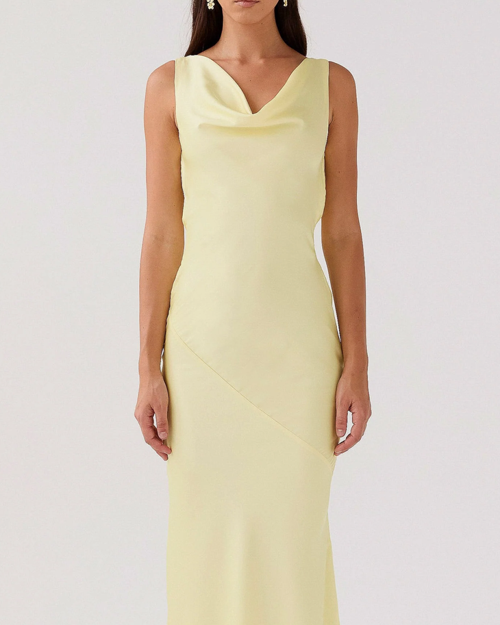 Woman wearing pale yellow satin sleeveless maxi dress with cowl neckline — Peppermayo | Endless UAE