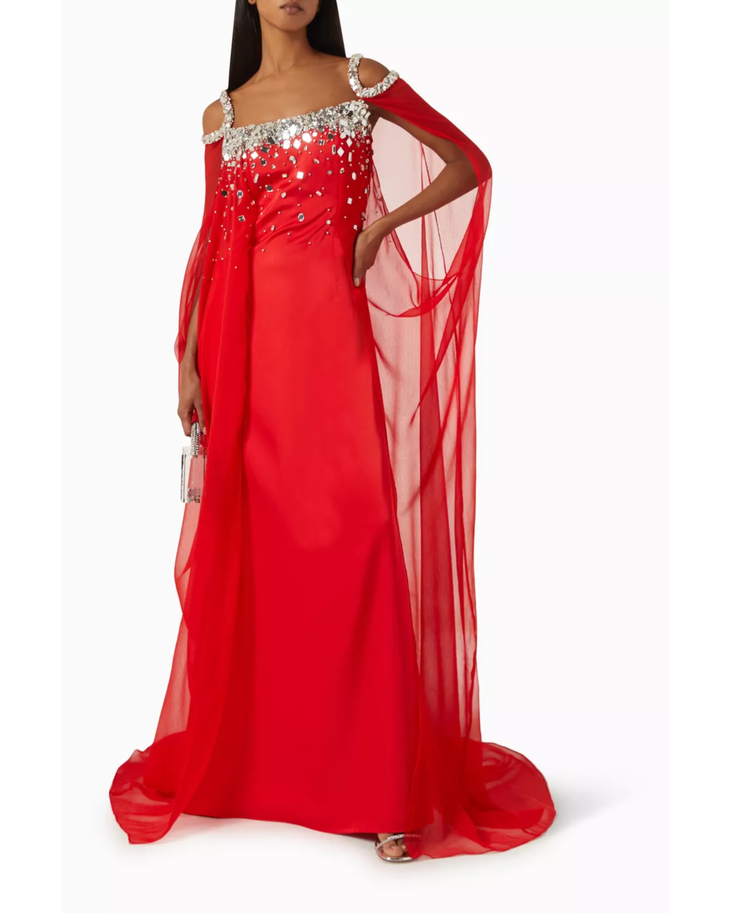 Red embellished cold-shoulder gown with crystal details and flowing cape — Anatomi | Endless UAE
