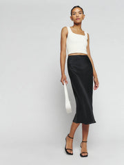 Black silk midi skirt with white crop tank top and black platform sandals — Reformation | Endless UAE