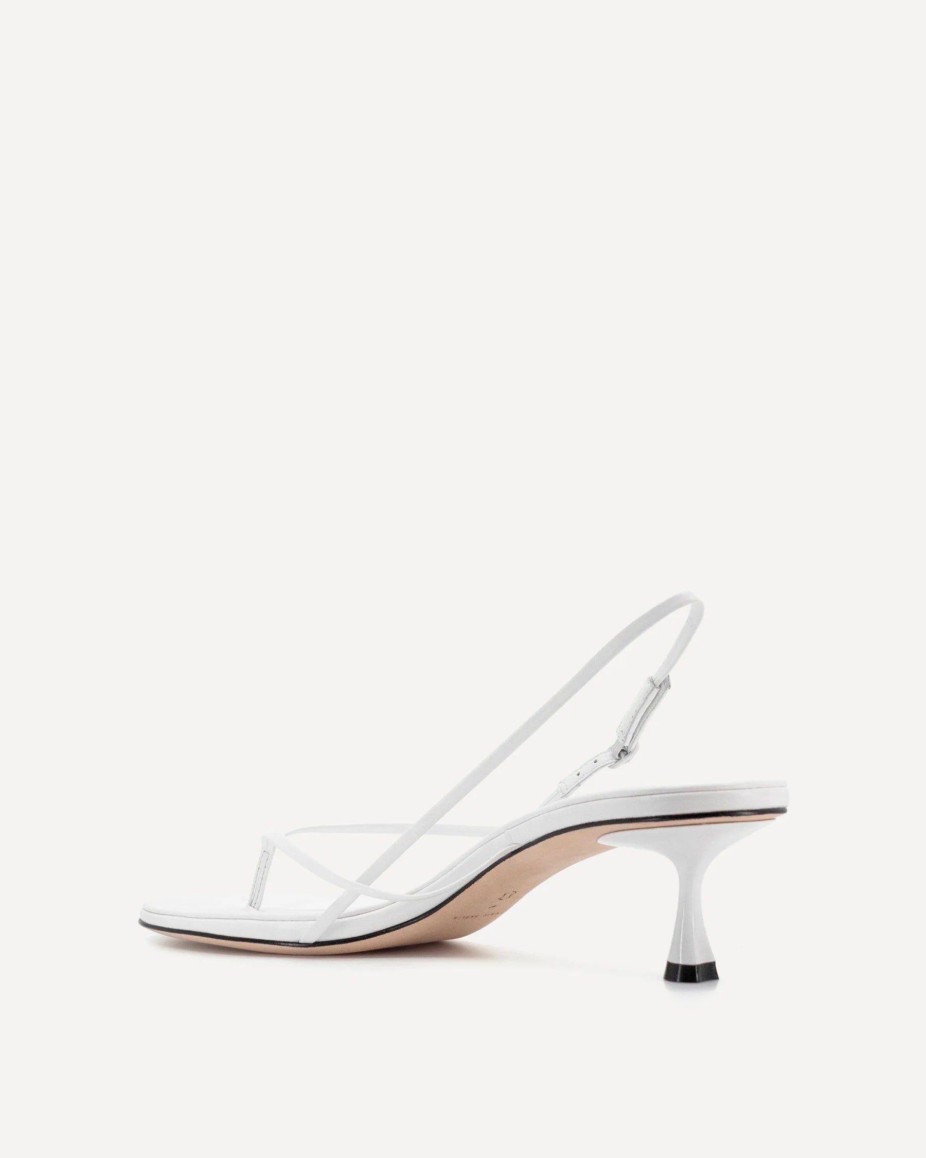 White leather slingback heel with curved wishbone design and sculpted kitten heel — Studio Amelia | Endless UAE