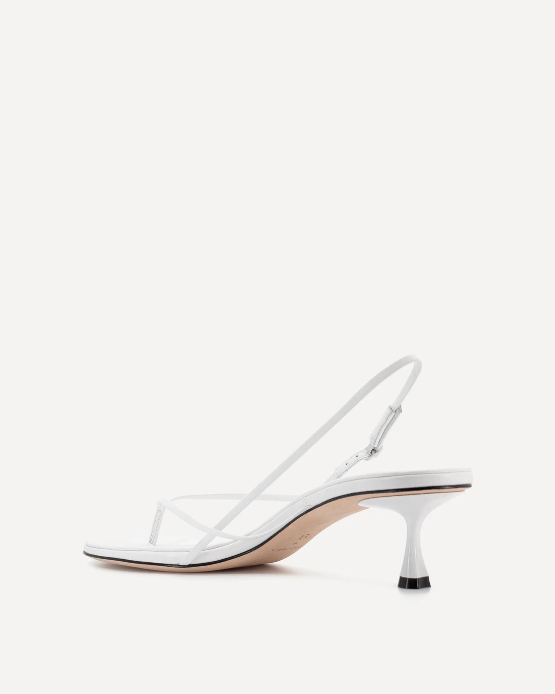 White leather slingback heel with curved wishbone design and sculpted kitten heel — Studio Amelia | Endless UAE