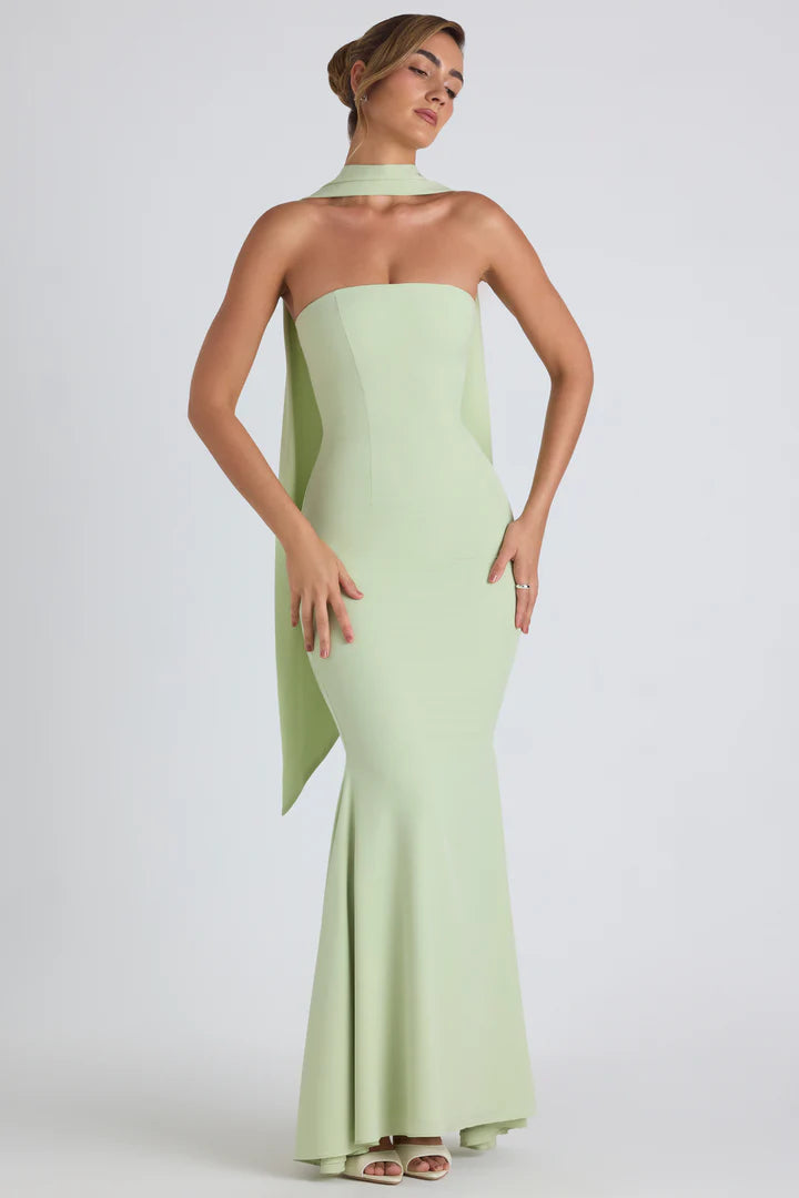 Woman wearing pale green strapless gown with flowing scarf detail — Oh Polly | Endless UAE