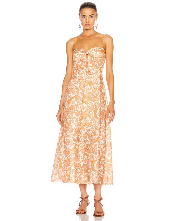 Woman wearing orange paisley tie dress with thin straps and midi length — Zimmermann | Endless UAE
