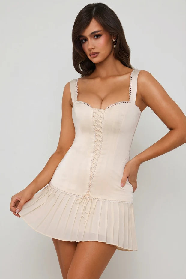 Cream lace-up corset mini dress with pleated skirt detail — Oh Polly | Endless UAE