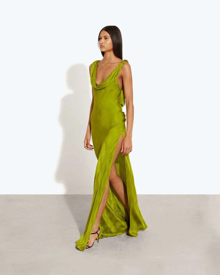 Woman wearing lime green velvet backless maxi dress with draped back detail — Rat & Boa | Endless UAE