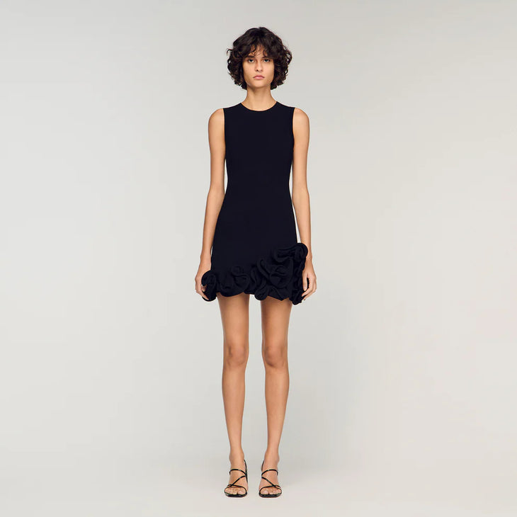 Black sleeveless knit dress with floral ruffle hem detail — Sandro | Endless UAE