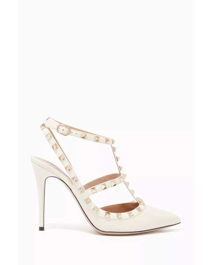 Cream leather pointed-toe pump with signature pyramid stud straps — Valentino Garavani | Endless UAE